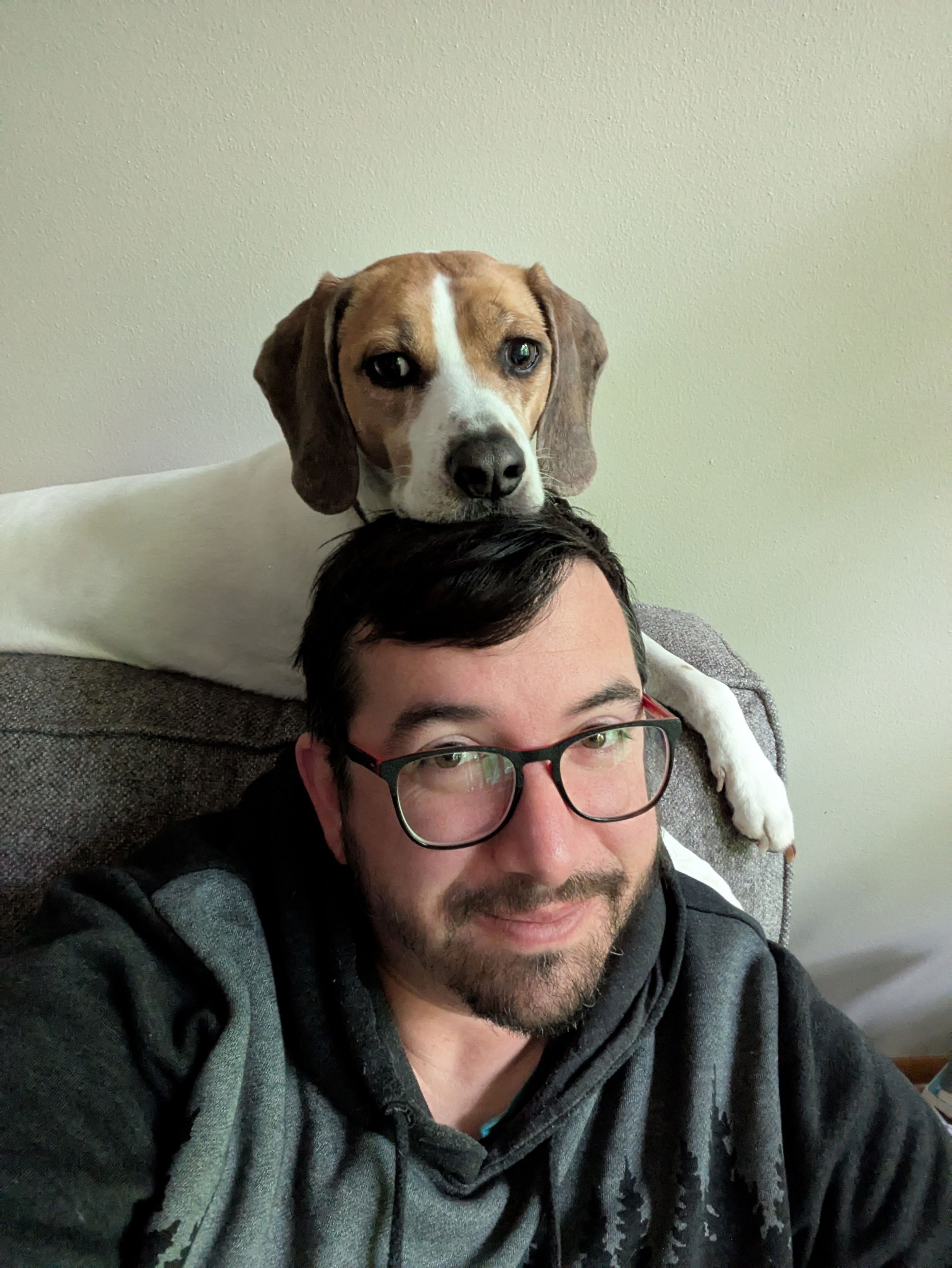 Wendy the dog with her head on top of Mike's